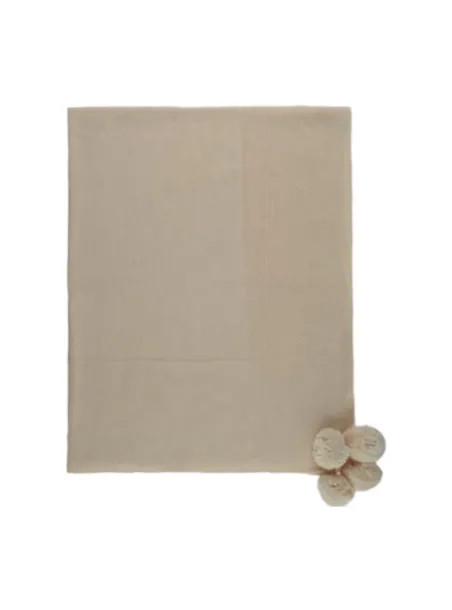 Knitted blanket with pompons